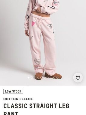 SKIMS Classic Straight Leg Cotton Fleece Pants in Light Pink with Graphic Hearts
